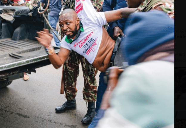 Njeri Mwangi Breaks Silence After Boniface Mwangi's Social Media Accounts Were Disabled. Boniface Mwangi gets arrested by police while protesting at Nairobi city center. Picture/Courtesy